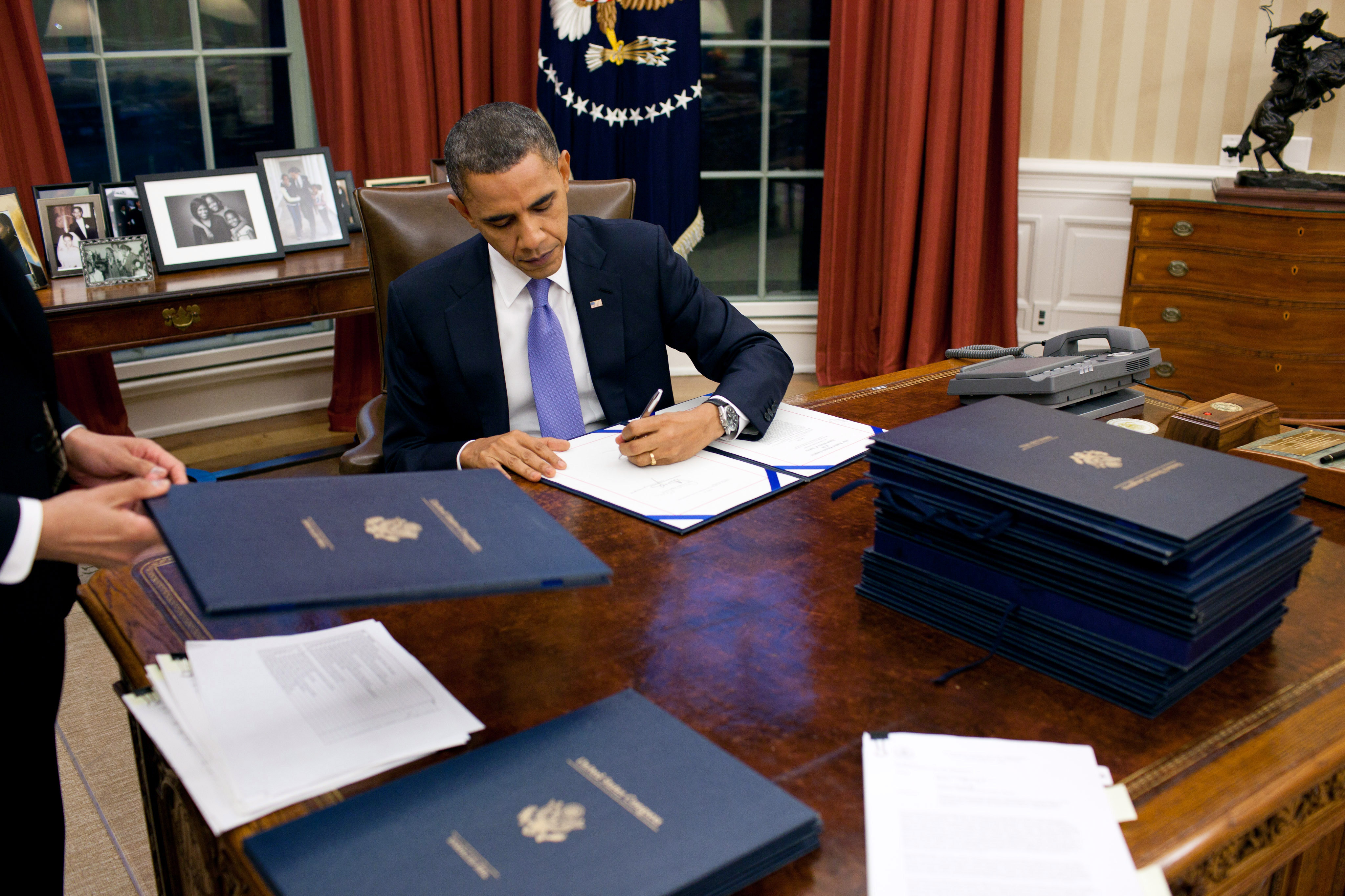 BarackObamaSigningLegislation